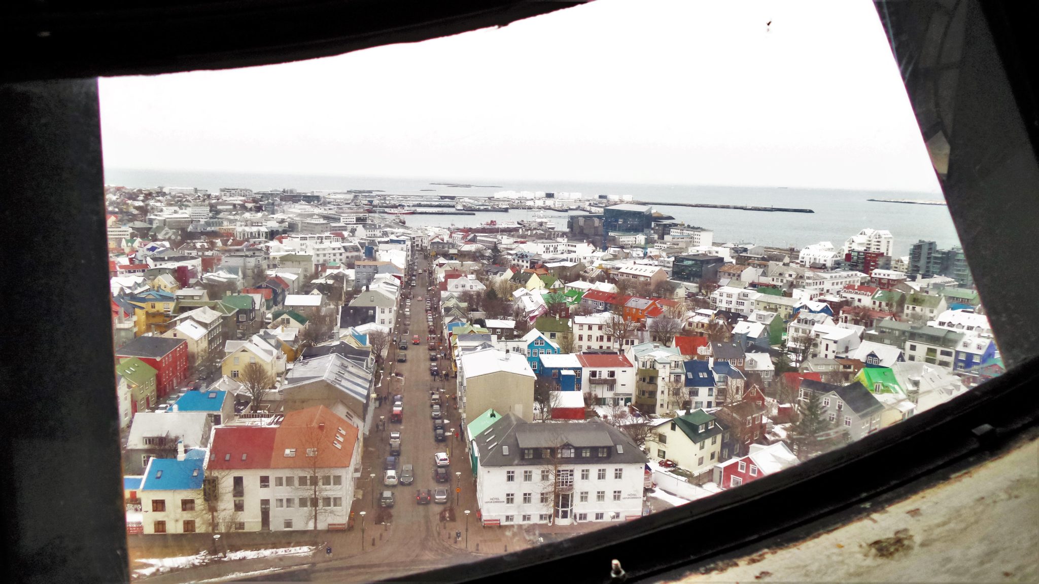 Through the clock face, view of Reykjavik from the Hallgrimskirkja observation tower, Reykjavik, Iceland