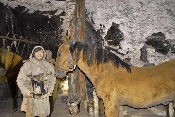 Man with horse models, Wieliczka Salt Mine, Poland